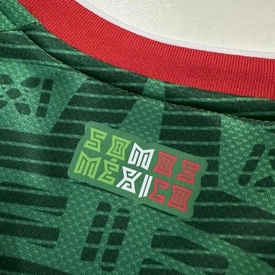 Close-up of a green sports jersey with a 'Somos Mexico' tag.