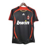 AC Milan Third Jersey 2006/07 front view in charcoal with red side panels, gold piping, AC Milan crest and Bwin sponsor