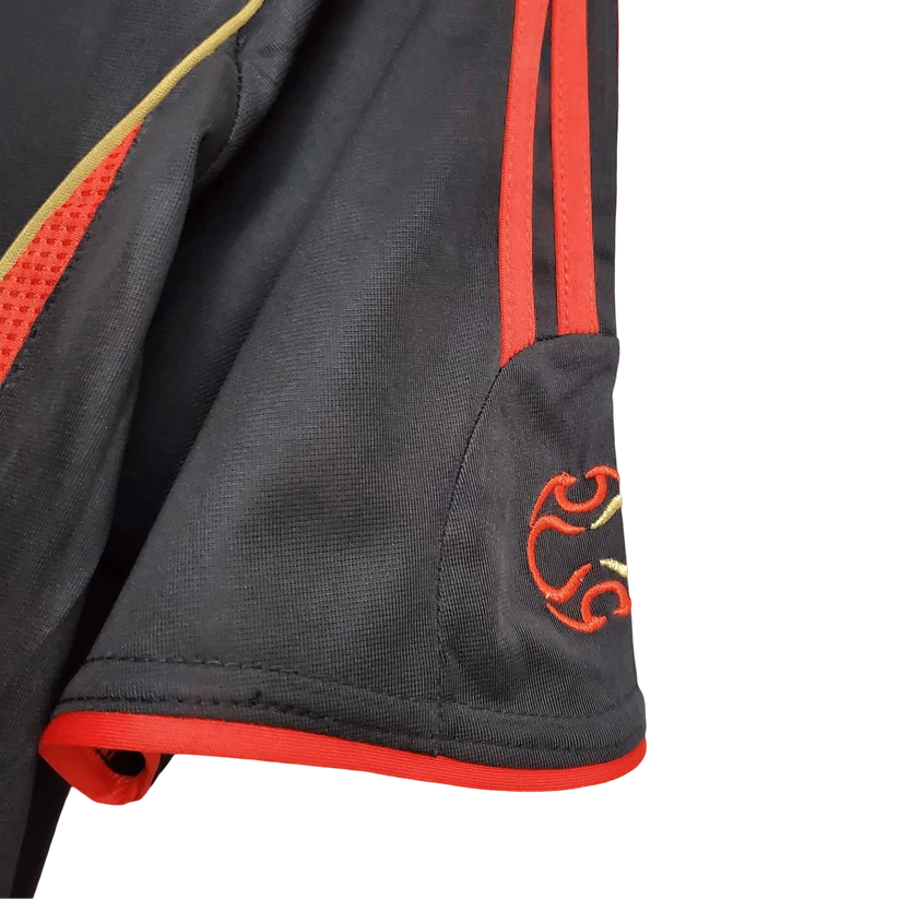 AC Milan Third Jersey 2006/07 sleeve close-up showing red shoulder stripes, red cuff trim and embroidered sleeve detail