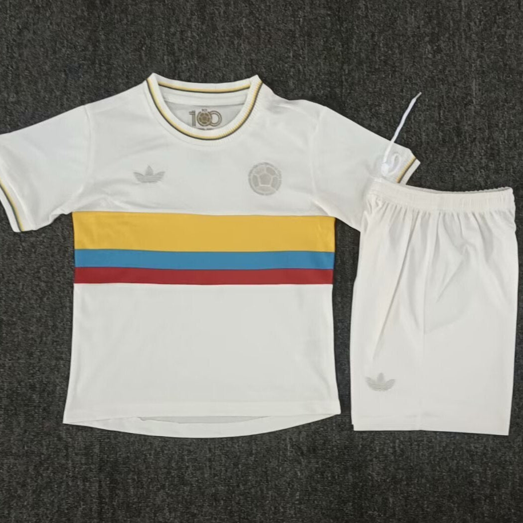 Adidas Colombia 100th anniversary kids football kit front view white jersey with Colombia flag stripe and matching shorts
