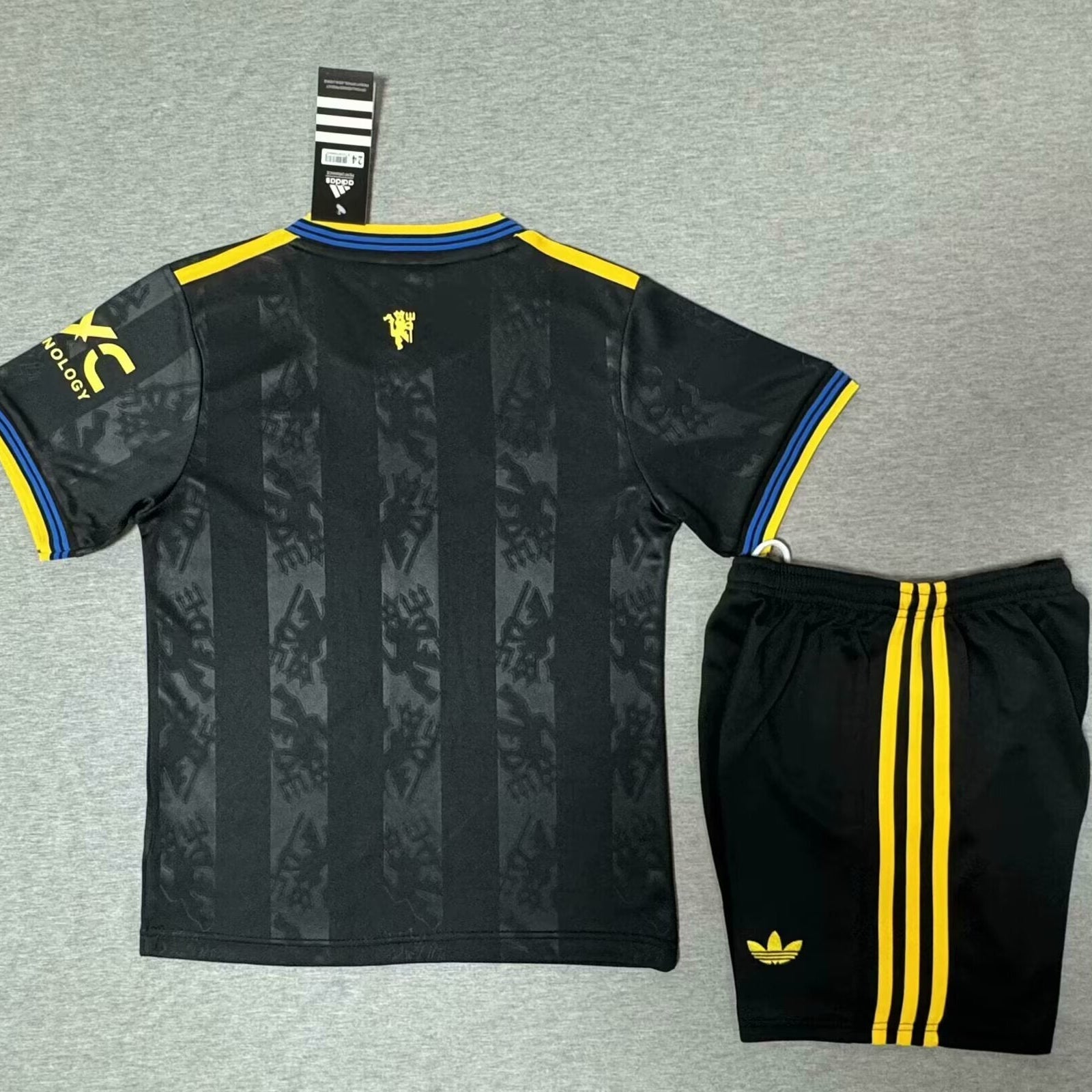 Adidas Manchester United away kit 2025 26 kids back view youth football set