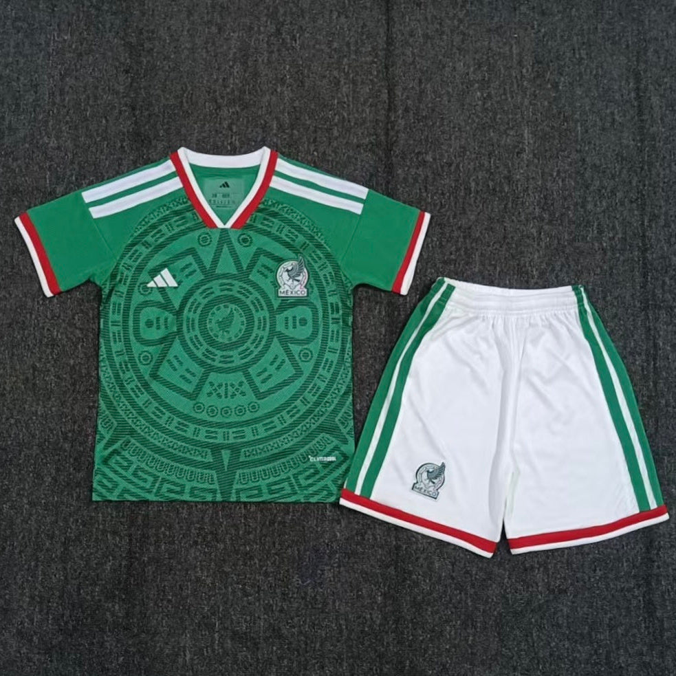 Adidas Mexico home kit 2026/27 kids set front view green jersey with white shorts
