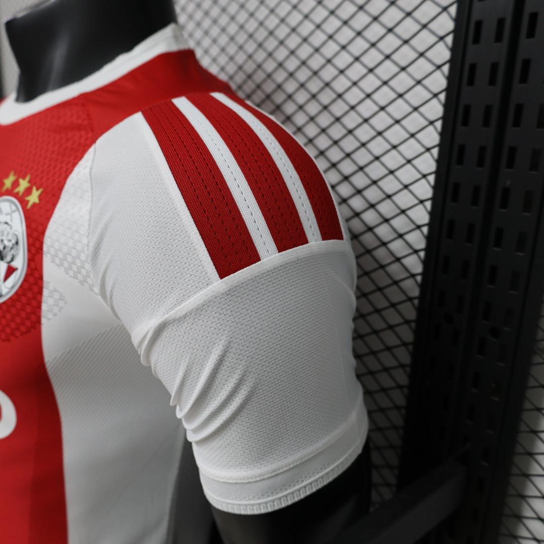 Ajax Home Jersey 2026/27 shoulder detail with white Adidas stripes