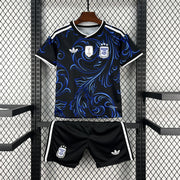 Argentina Away Jersey 2026 Kids Set front view with black shirt, electric blue swirling graphics, Argentina crest and matching black shorts