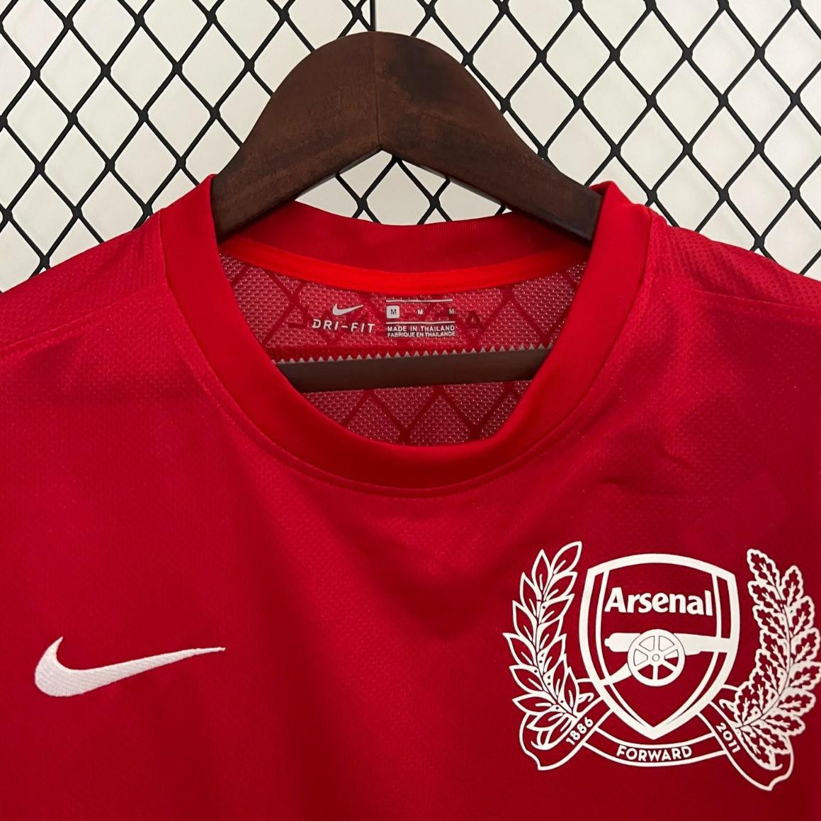 Arsenal 125th anniversary crest on 2011/12 home kit
