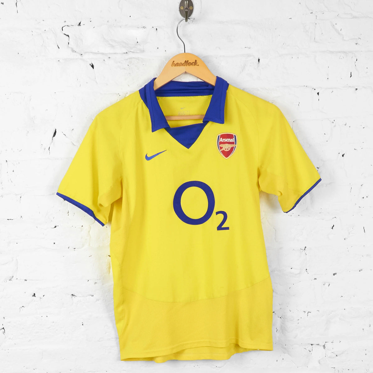 Arsenal Away Jersey 2003 front view in yellow with blue collar and O2 sponsor