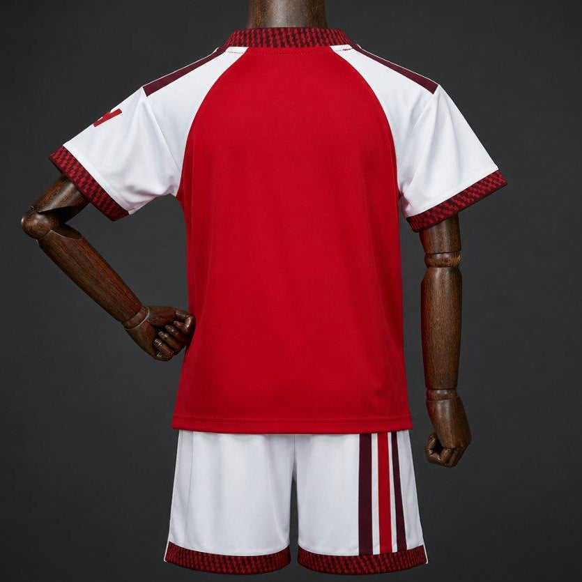 Arsenal Home Jersey 2026 Kids Set back view with red jersey and white shorts
