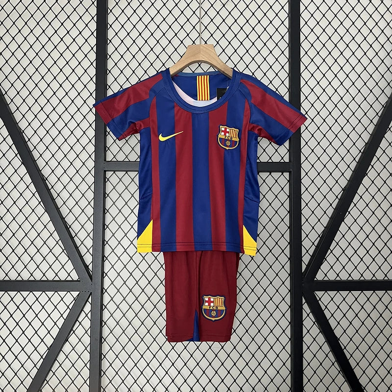 Barcelona Home Jersey 2005/06 Kids Set front view with blue and deep red vertical stripes, yellow details, club crest and matching shorts