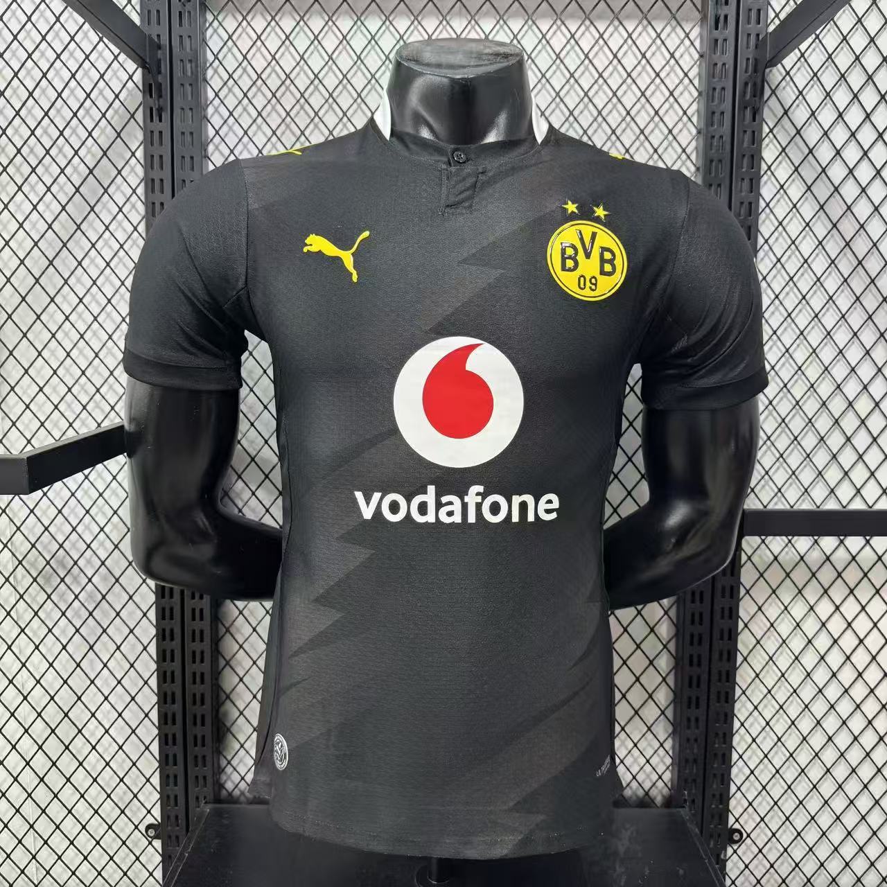 Borussia Dortmund 2026/27 black jersey front display with BVB crest and Vodafone sponsor