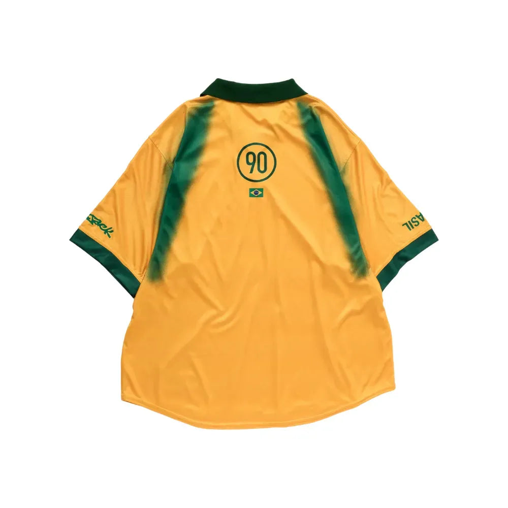 Brazil Retro Jersey 2026 front view in yellow with deep green collar, sleeve trim and sweeping green graphic details