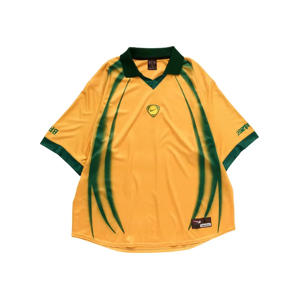 Brazil Retro Jersey 2026 front view in yellow with deep green collar, sleeve trim and sweeping green graphic details