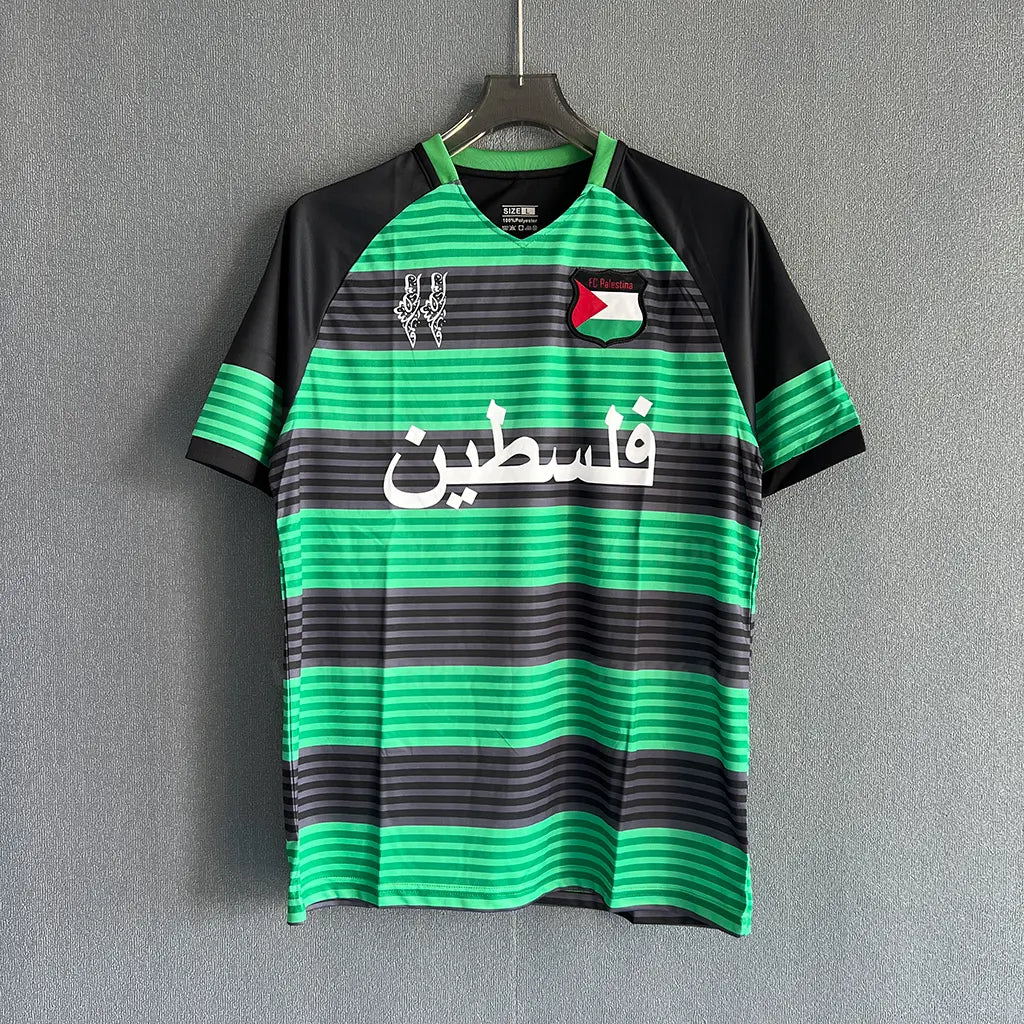 CD Palestine 2024/25 green jersey with black horizontal stripes and Arabic text front view