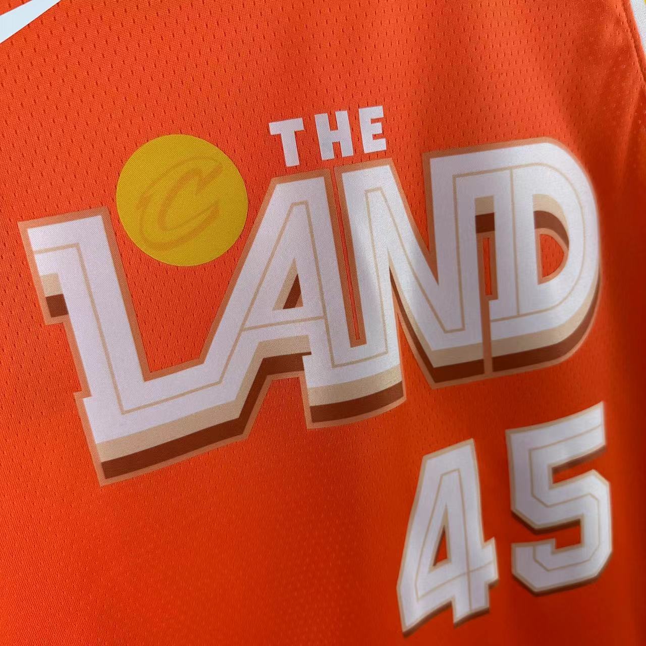 Cleveland Cavaliers 2025/26 City Edition youth jersey Donovan Mitchell number 45 orange The Land front view