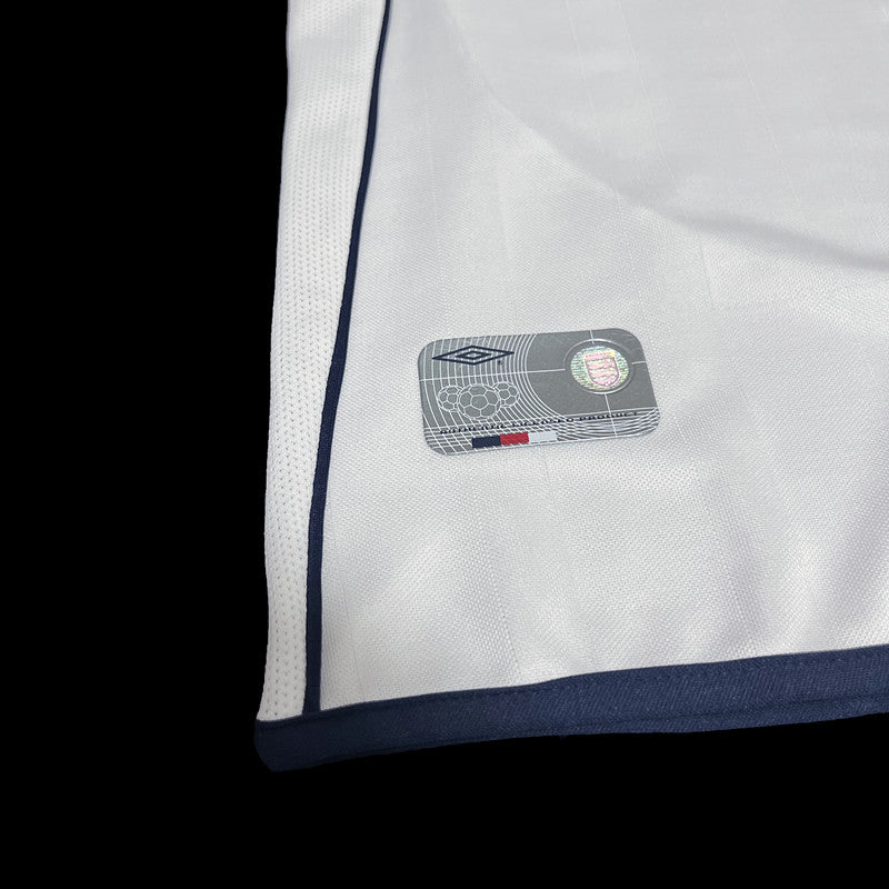 England Home Jersey 2002 lower side detail with navy piping and hem label