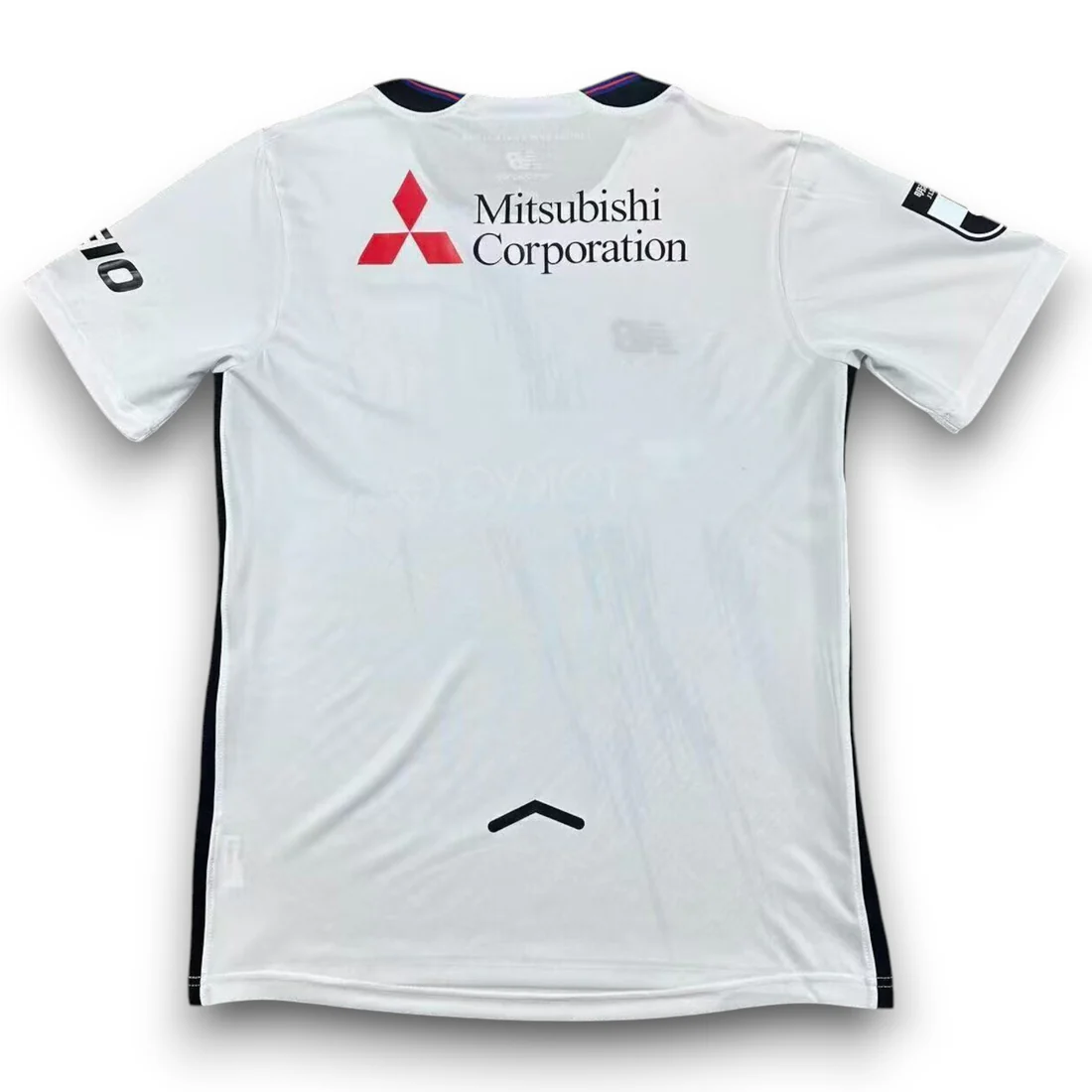 FC Tokyo Away Jersey 2026/27 back view in white with Mitsubishi Corporation sponsor and navy side detailing