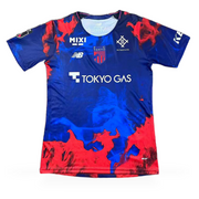 FC Tokyo Home Jersey 2026/27 front view in deep blue with red and electric blue graphic details, club crest and Tokyo Gas sponsor