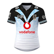 Fiji Bati Rugby League World Cup 2026 Home Jersey front view, white and light blue with black sleeves, tribal V chest graphic, Bati crest and Vodafone sponsor