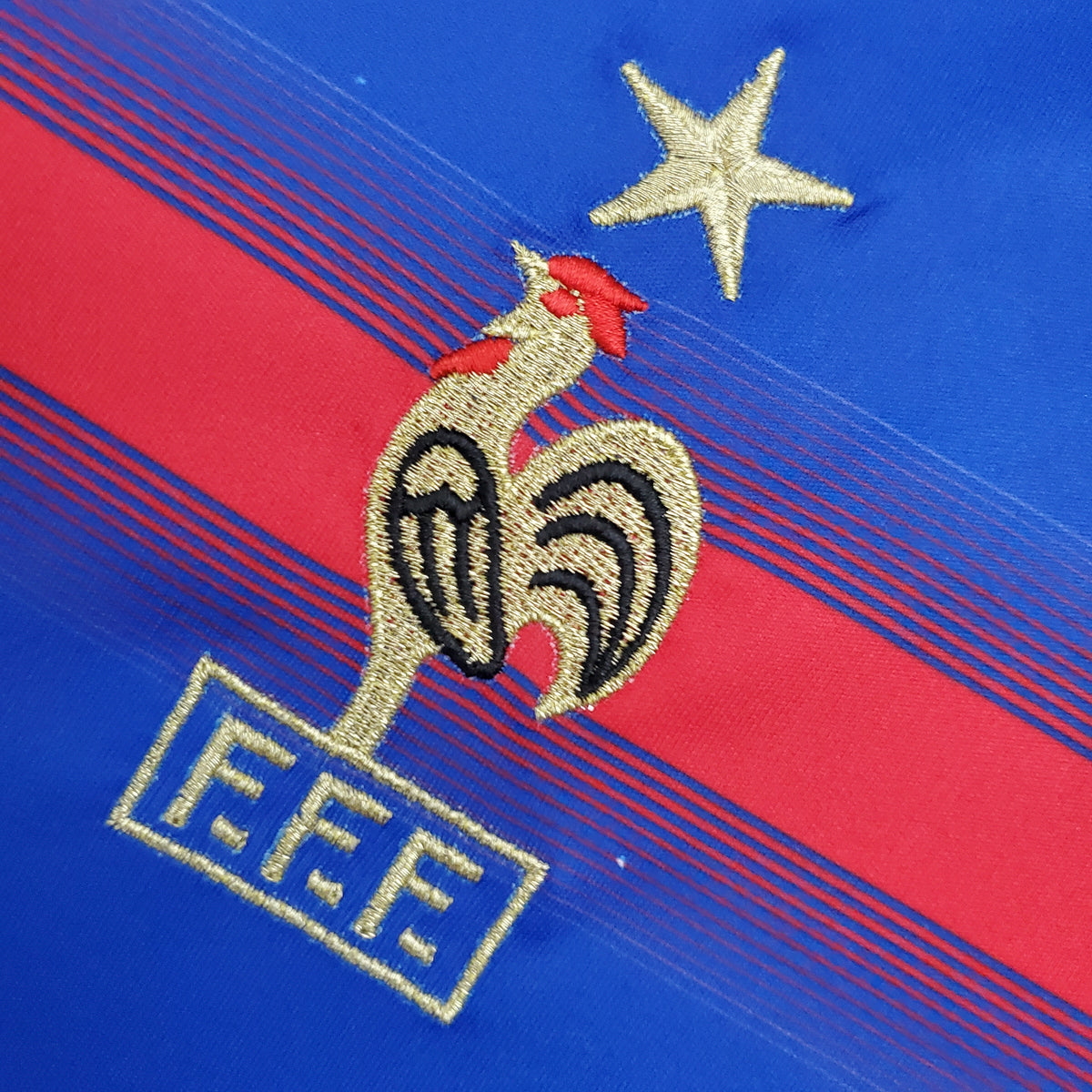 France national team crest with championship star on 2004 home jersey