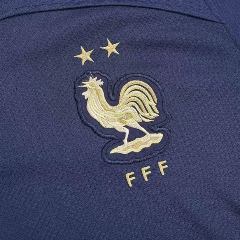 France Home Jersey 2022 crest detail with gold rooster and two championship stars