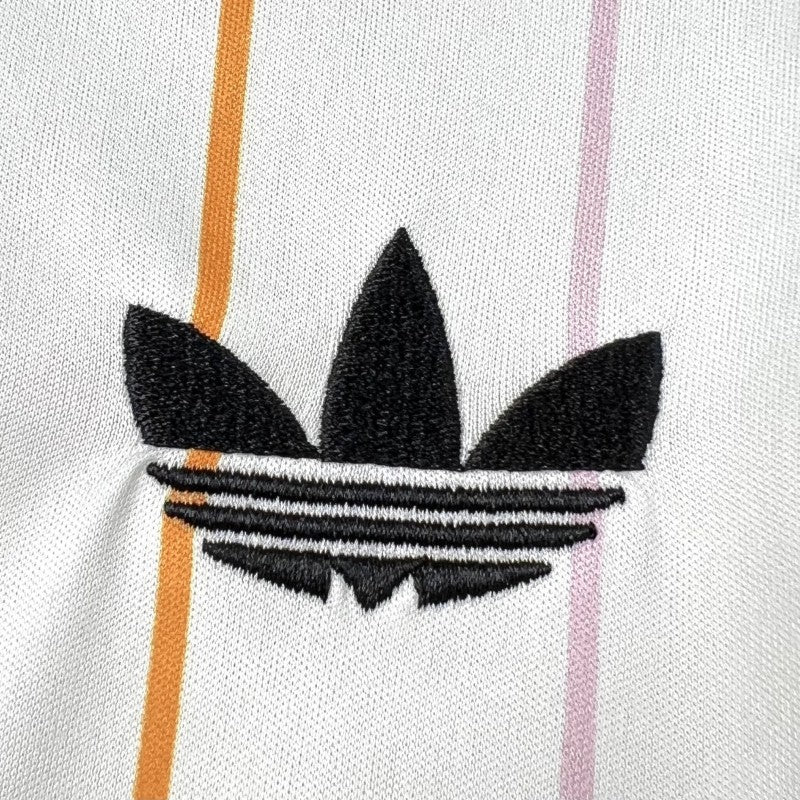 Japan Away Jersey 2026 close-up of the front logo on the white striped base