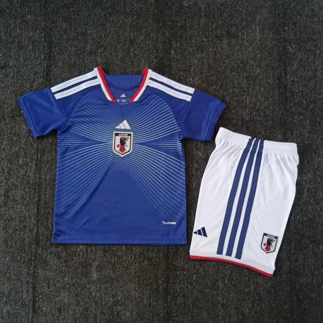 Japan home kit 2026/27 kids set front view blue jersey with white shorts
