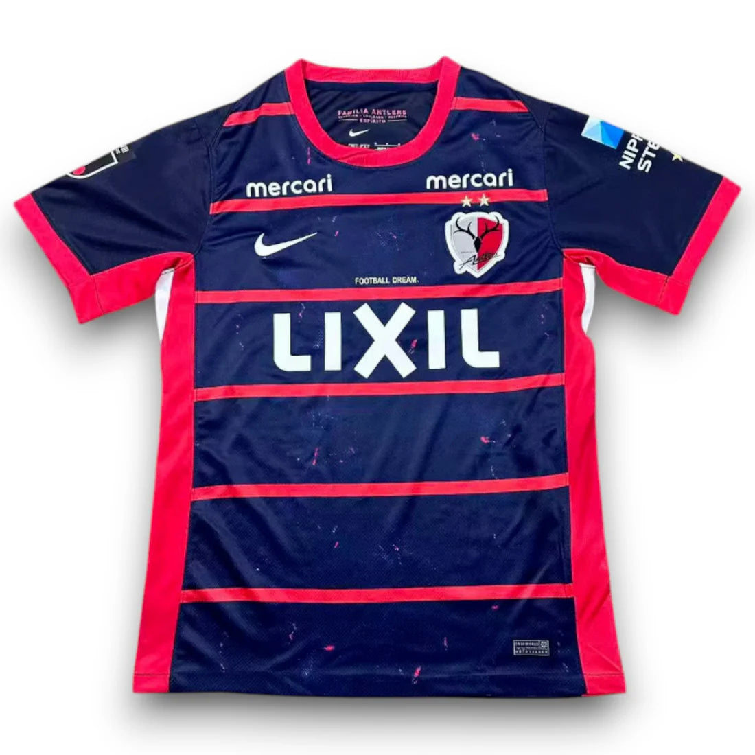 Kashima Antlers Home Jersey 2026/27 front view in navy with red horizontal stripes, red side panels, club crest and LIXIL sponsor