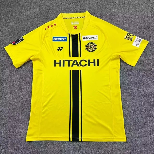 Kashiwa Reysol Home Jersey 2026/27 front view in bright yellow with black centre stripes, club crest and HITACHI sponsor