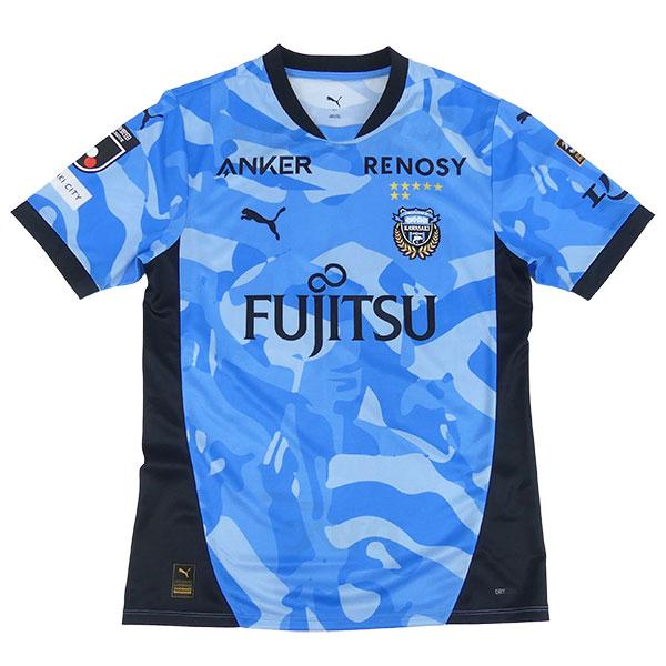 Kawasaki Frontale Home Jersey 2026/27 front view in light blue camouflage pattern with navy side panels, club crest and FUJITSU sponsor