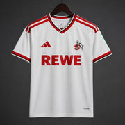 Koln Home Jersey 2026/27 front view in white with red Adidas stripes and REWE sponsor