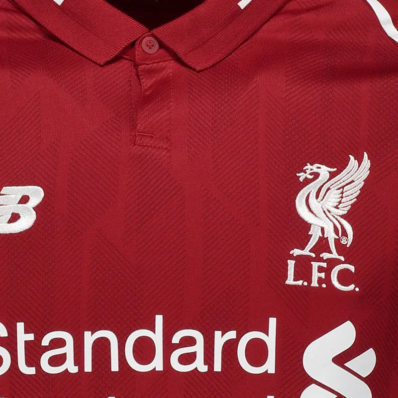 Liverpool Home Jersey 2018/19 crest detail with New Balance logo and Standard Chartered sponsor