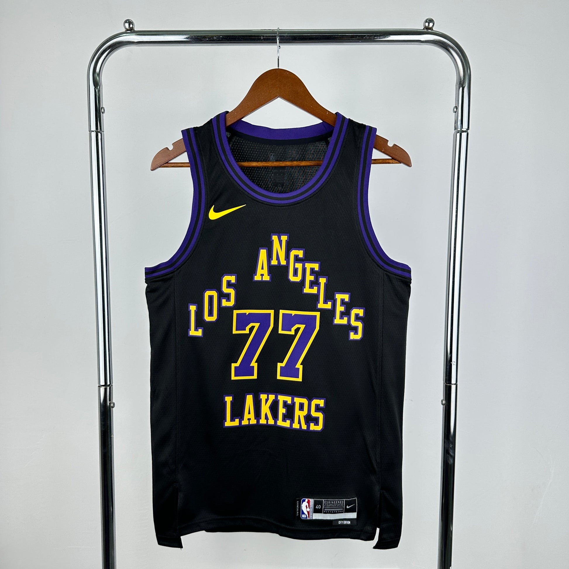 Los Angeles Lakers 2025/26 City Edition swingman jersey Luka Dončić number 77 black purple gold front and back view