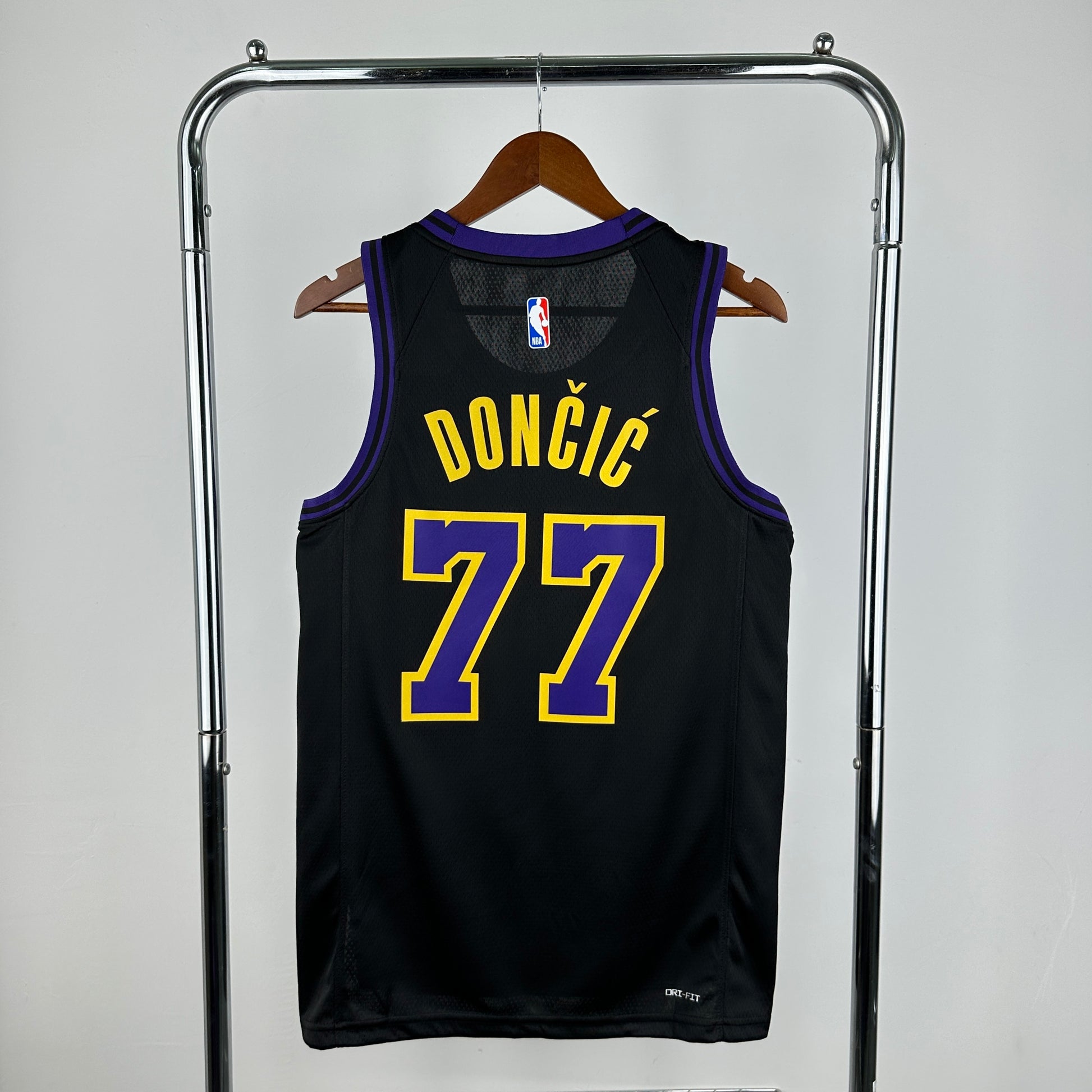 Los Angeles Lakers 2025/26 City Edition swingman jersey Luka Dončić number 77 black purple gold front and back view