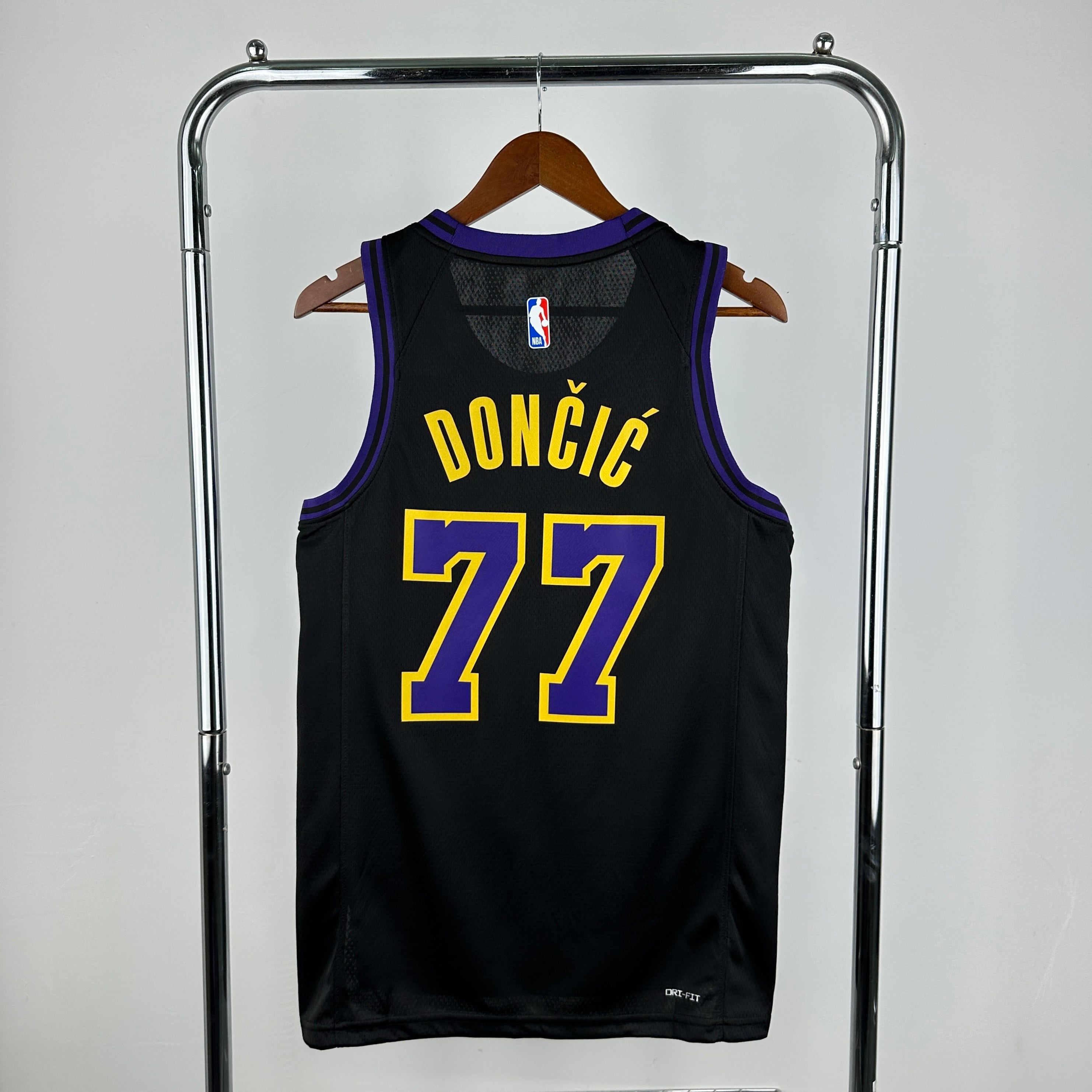 Los Angeles Lakers 2025/26 City Edition swingman jersey Luka Dončić number 77 black purple gold front and back view
