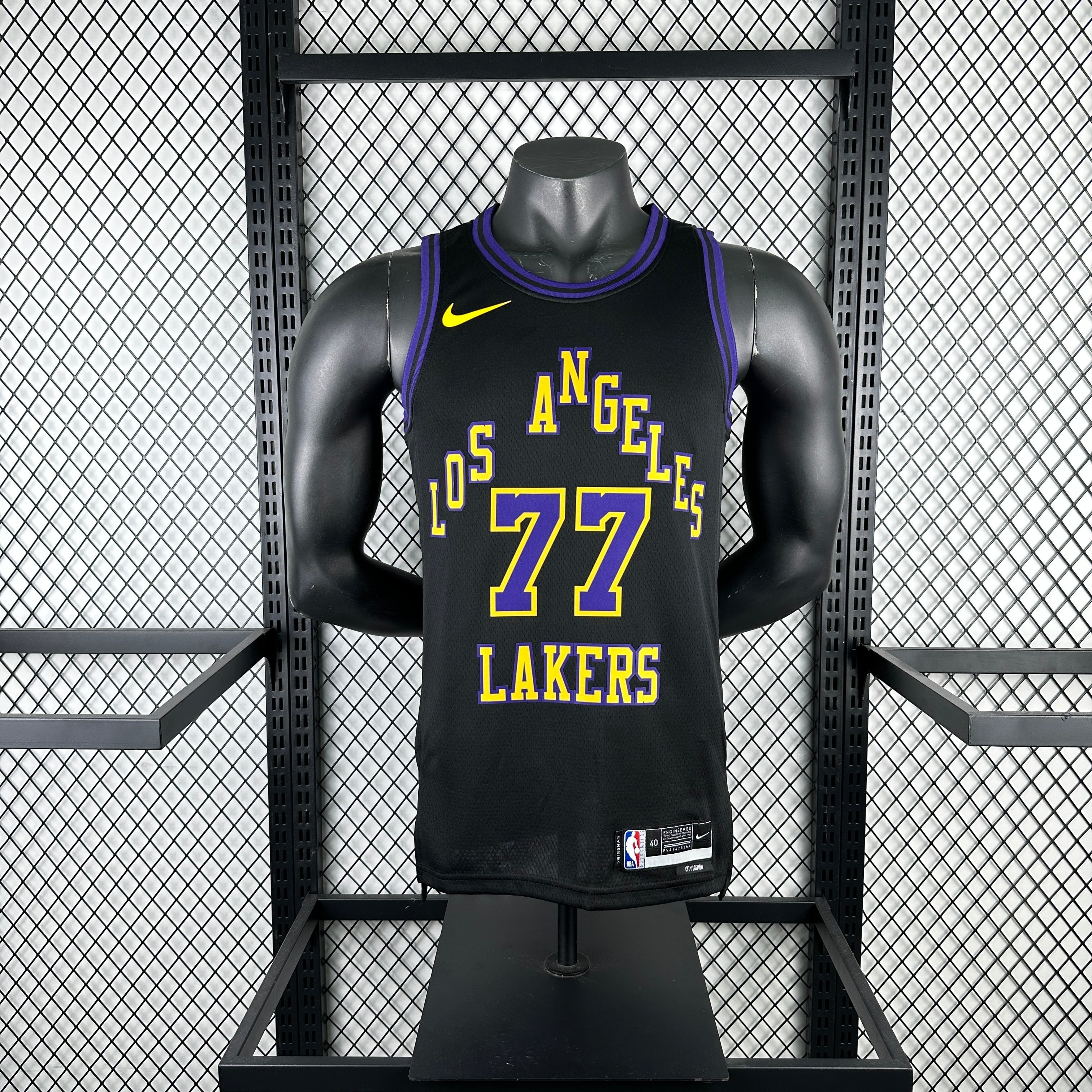 Los Angeles Lakers 2025/26 City Edition swingman jersey Luka Dončić number 77 black purple gold front and back view