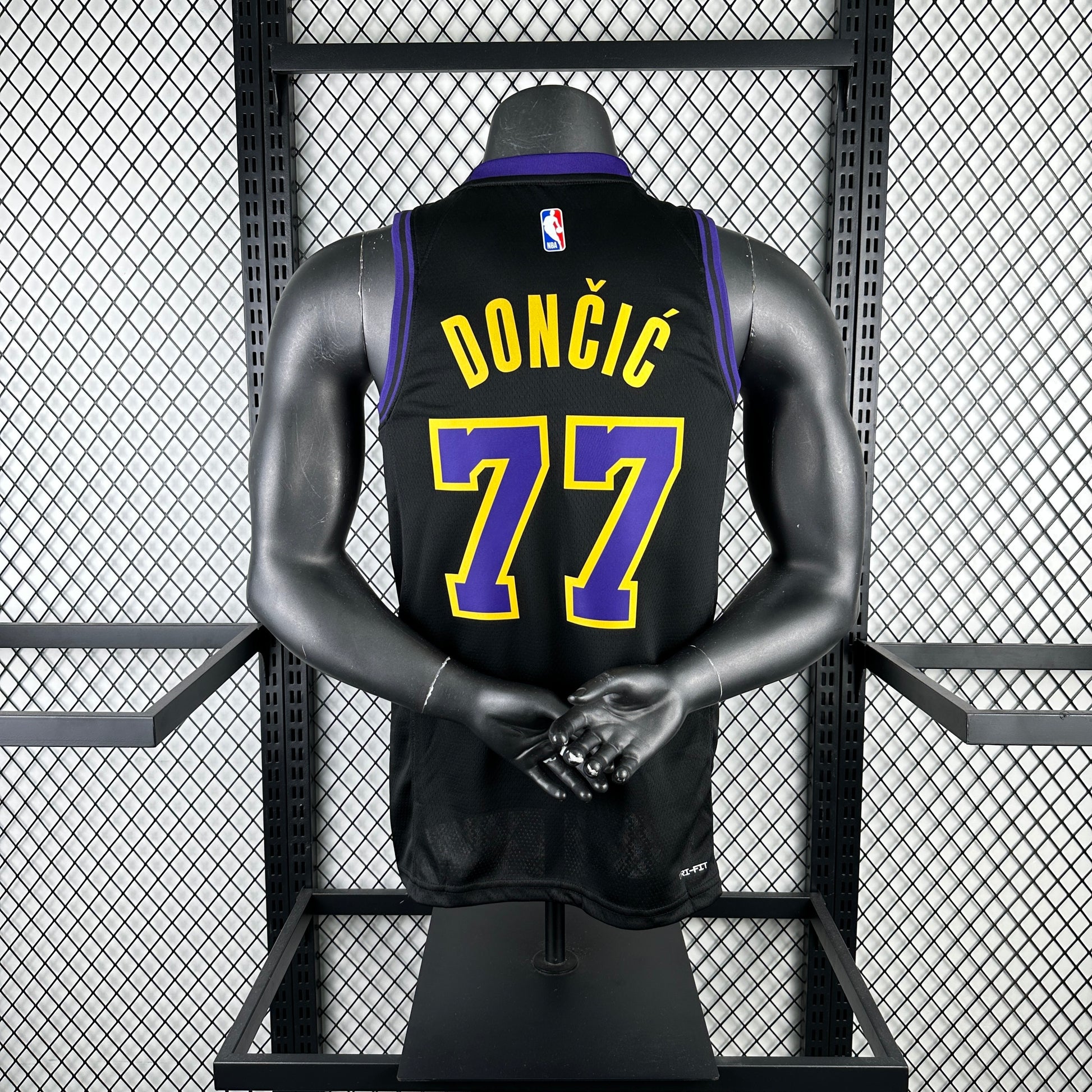 Los Angeles Lakers 2025/26 City Edition swingman jersey Luka Dončić number 77 black purple gold front and back view