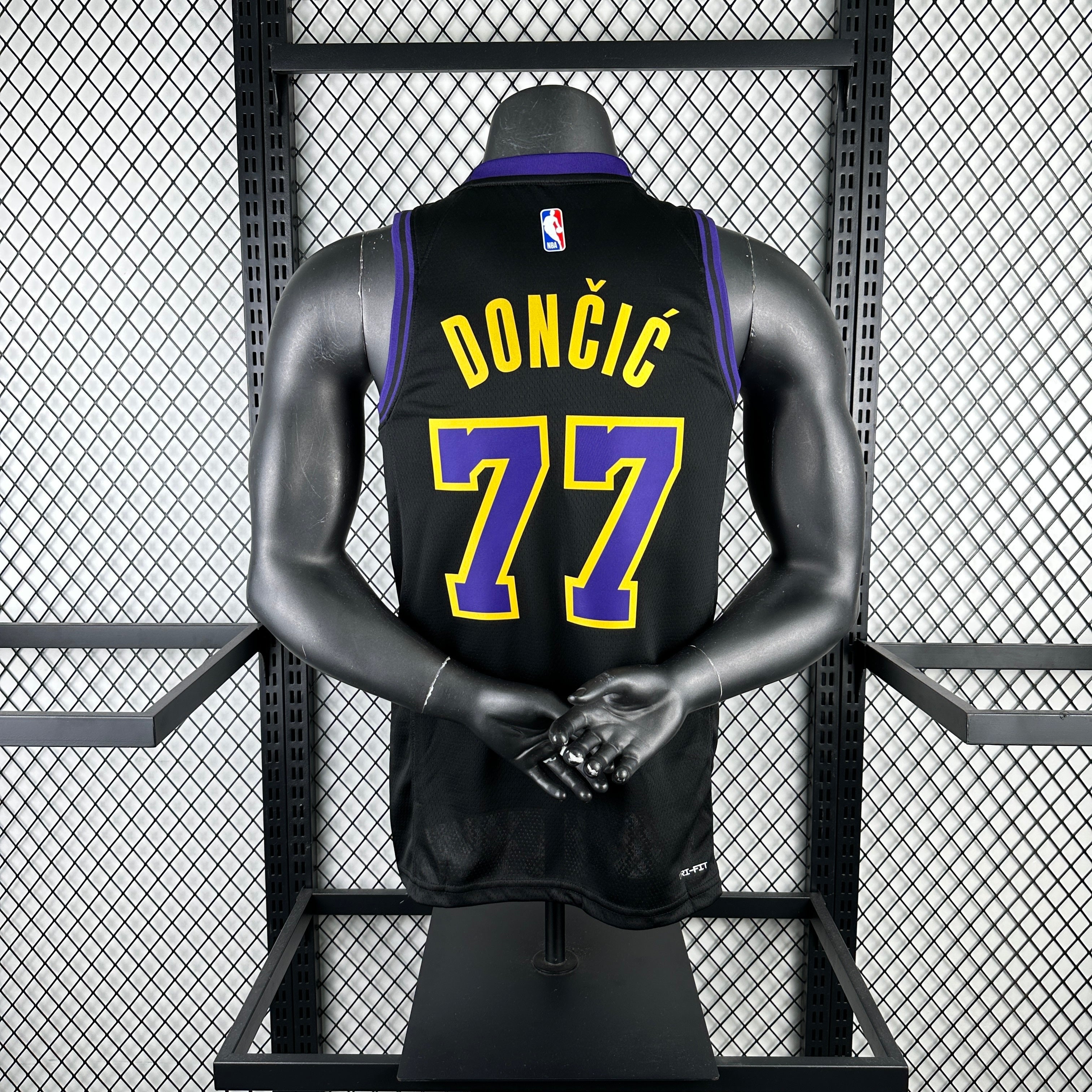 Los Angeles Lakers 2025/26 City Edition swingman jersey Luka Dončić number 77 black purple gold front and back view