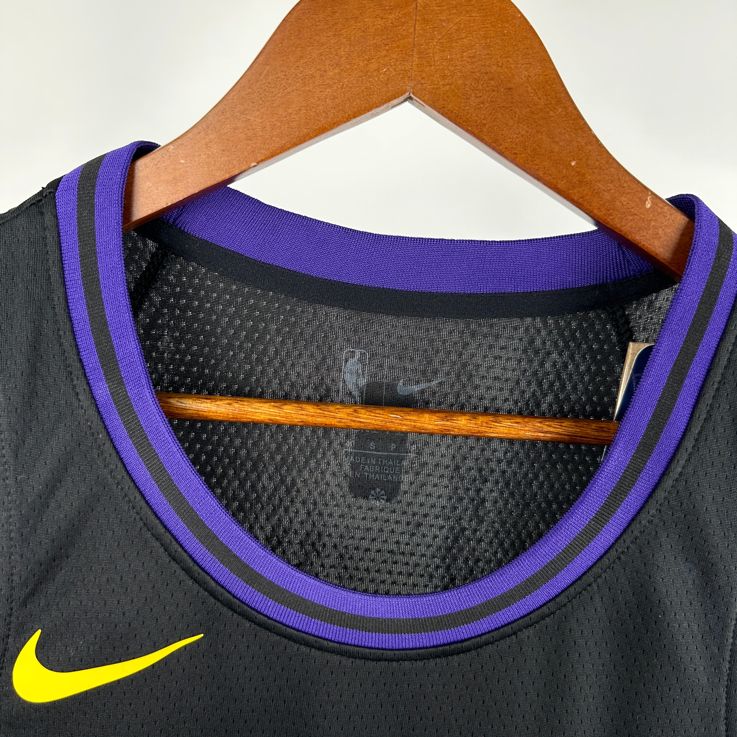 Los Angeles Lakers 2025/26 City Edition swingman jersey Luka Dončić number 77 black purple gold front and back view