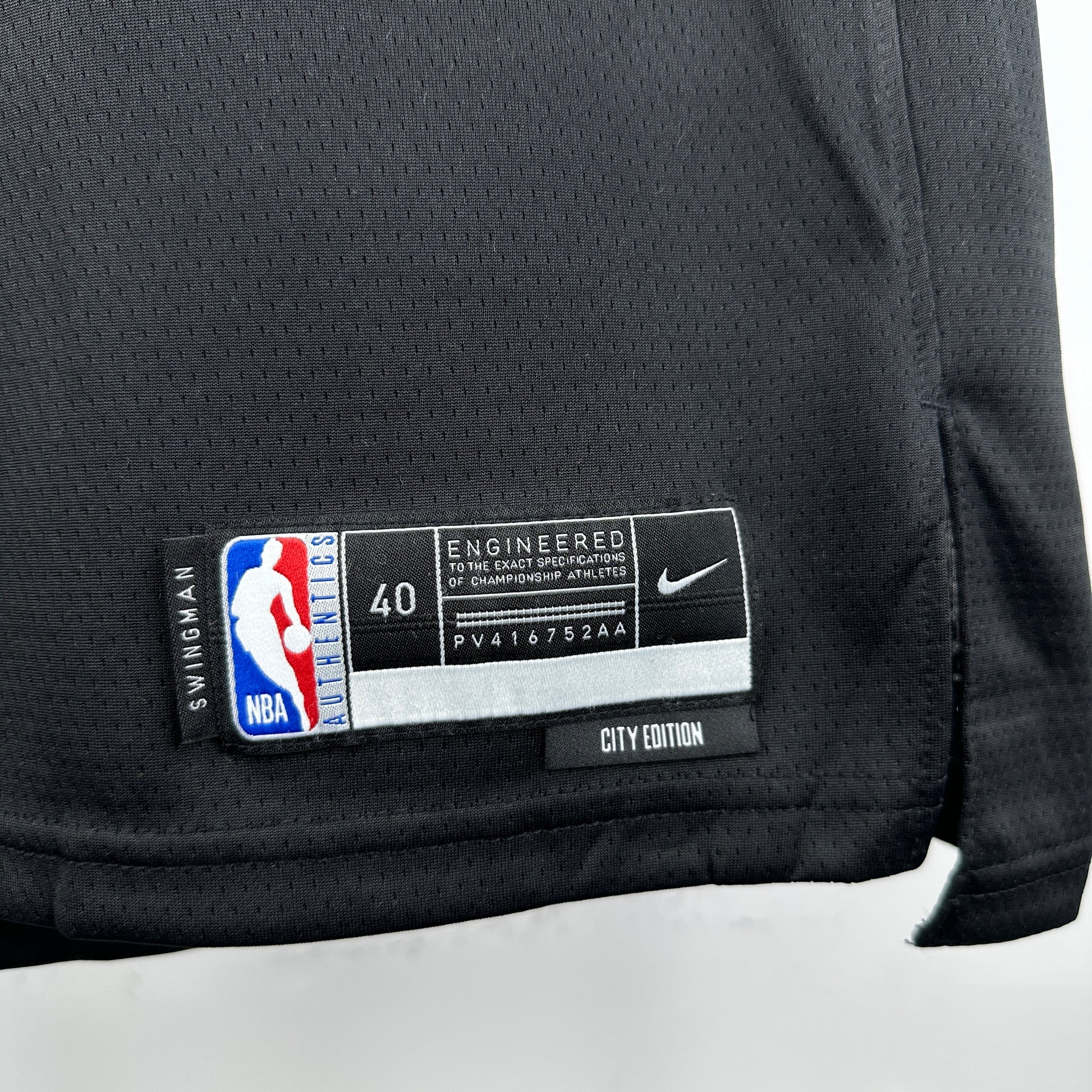 Los Angeles Lakers 2025/26 City Edition swingman jersey Luka Dončić number 77 black purple gold front and back view