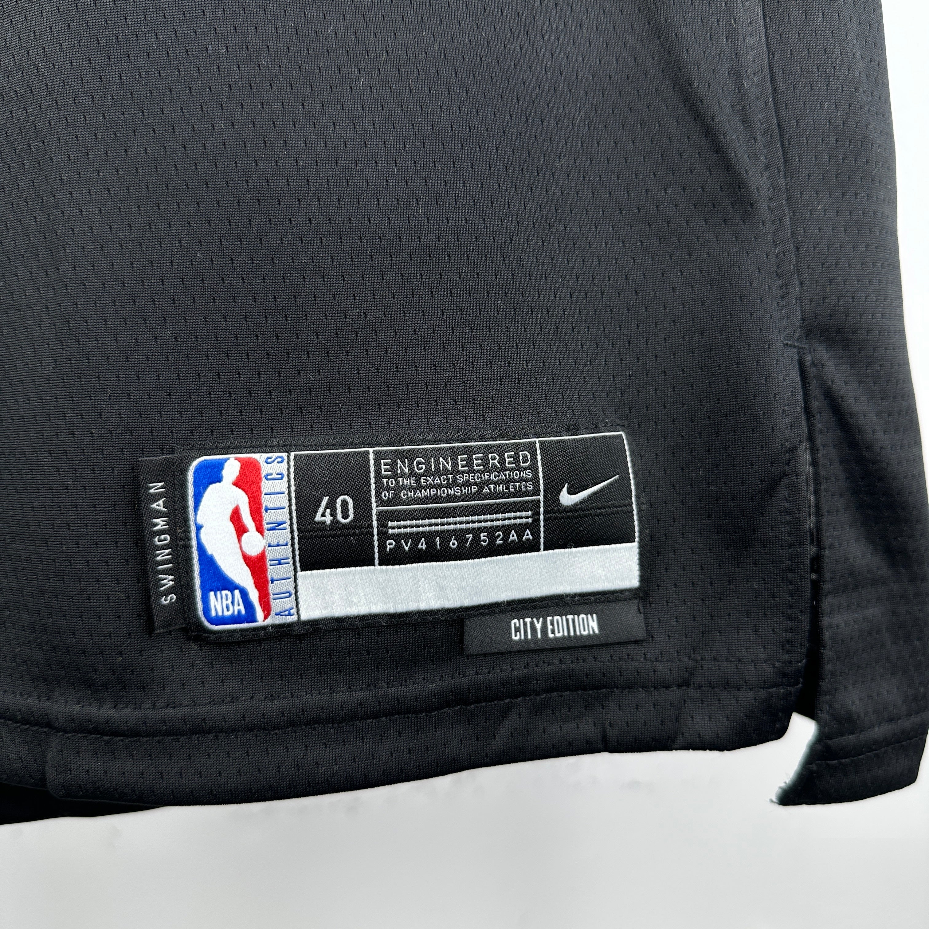 Los Angeles Lakers 2025/26 City Edition swingman jersey Luka Dončić number 77 black purple gold front and back view