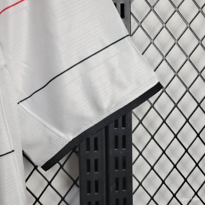 Close-up of the sleeve on the Manchester United Third Jersey 2003/04 showing the white sleeve with black cuff trim and fine horizontal pinstripe detailing