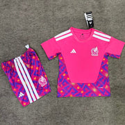 Mexico Goalkeeper Jersey 2026 Kids Set front view with pink short sleeve jersey and patterned shorts