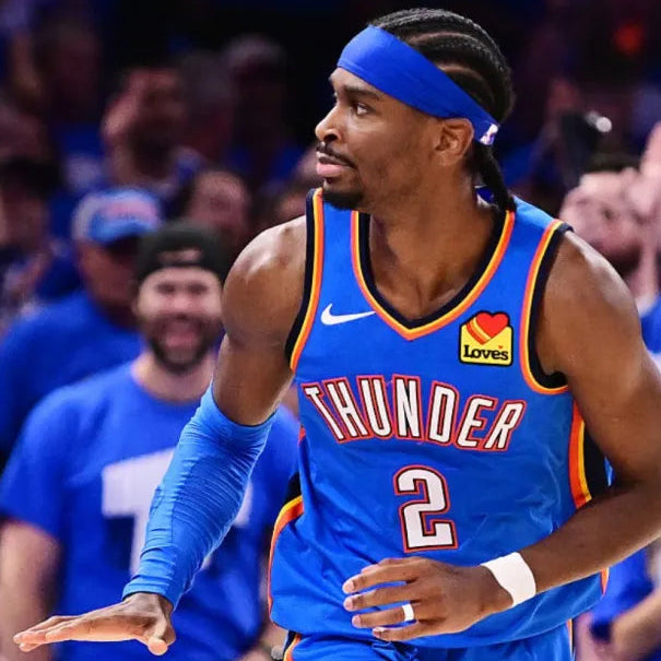 Basketball player in a blue jersey with 'Thunder' and number '2' on a crowd background