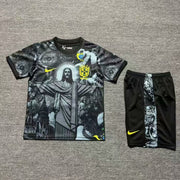 Nike Brazil special edition kids football kit front view black graphic jersey with matching shorts

