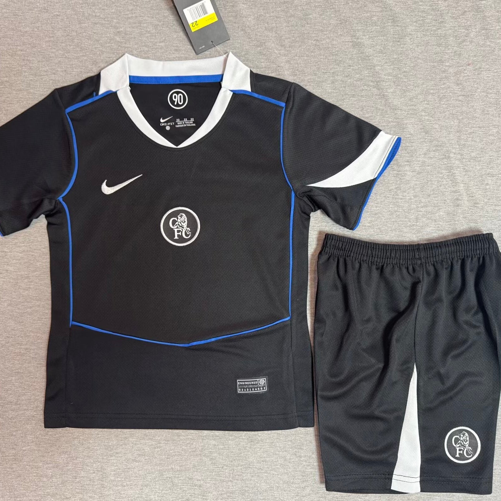 Nike Chelsea away kit 2025/26 kids set front view black jersey with matching shorts
