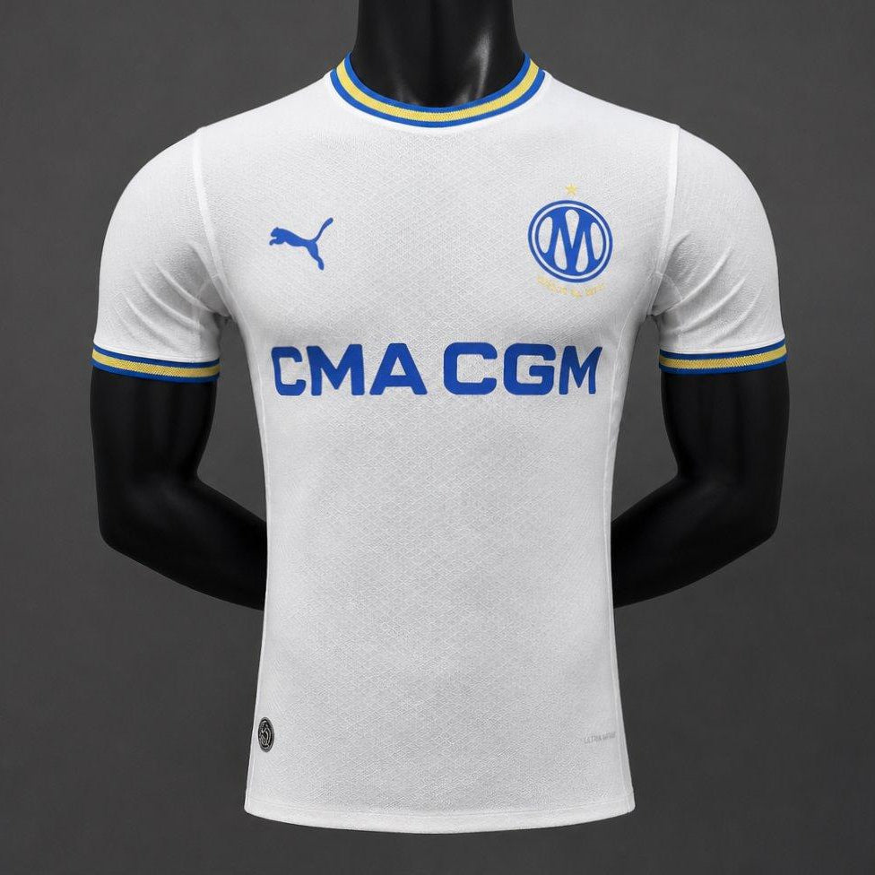 Olympique Marseille Home Jersey 2026/27 front view with white base blue and gold trim and CMA CGM sponsor