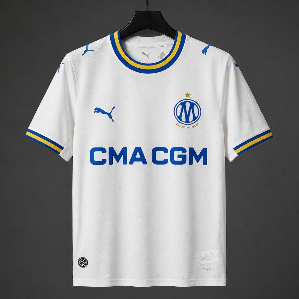Olympique Marseille Home Jersey 2026/27 front view with white base blue and gold trim and CMA CGM sponsor