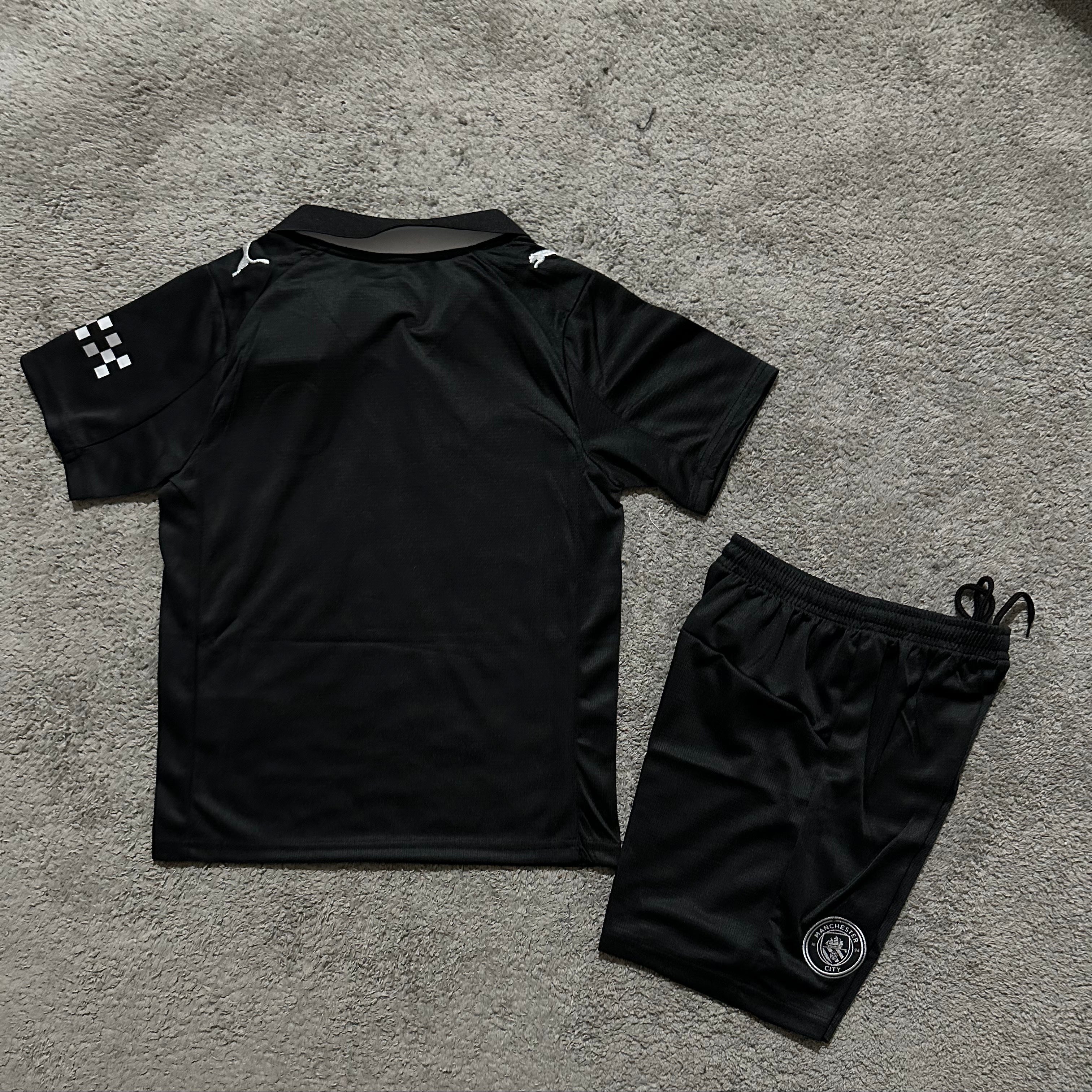 Puma Manchester City away kit 2025 26 kids back view youth football set