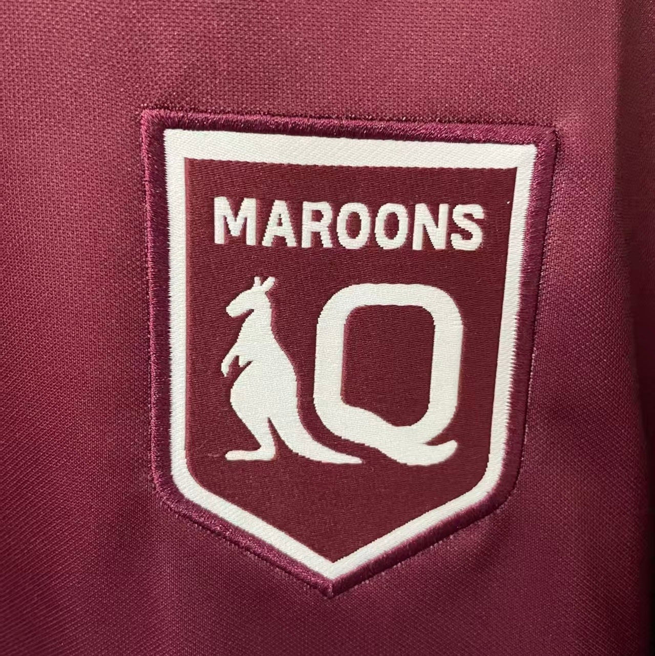 QLD Maroons 2026 State of Origin jersey team crest close up
