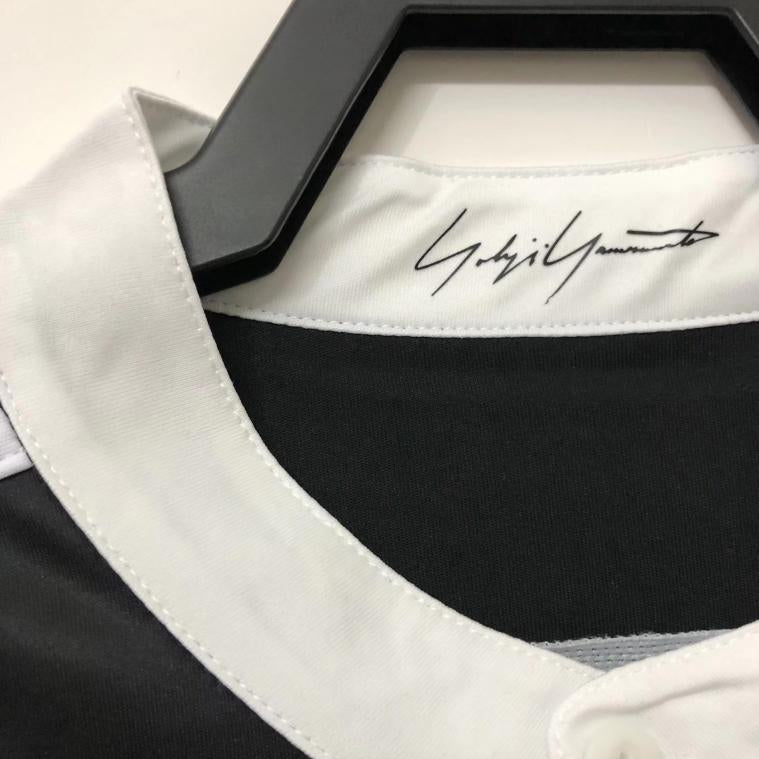 Real Madrid crest detail on black dragon jersey
