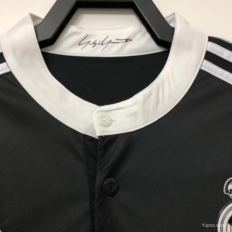 Real Madrid crest detail on black dragon jersey
